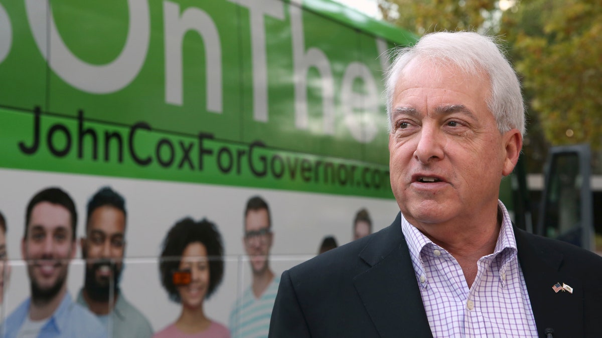 Republican gubernatorial candidate John Cox talks to reporters before beginning a statewide bus tour Thursday, Nov. 1, 2018, in Sacramento, Calif. (AP Photo/Rich Pedroncelli)