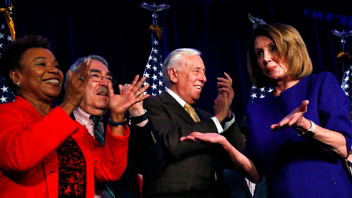 House Minority Leader Nancy Pelosi of Calif., right, dances to the music as she steps away from the podium past Rep. Barbara Lee, D-Calif., far left, and Rep. G.K. Butterfield, D-N.C. (AP Photo/Jacquelyn Martin)