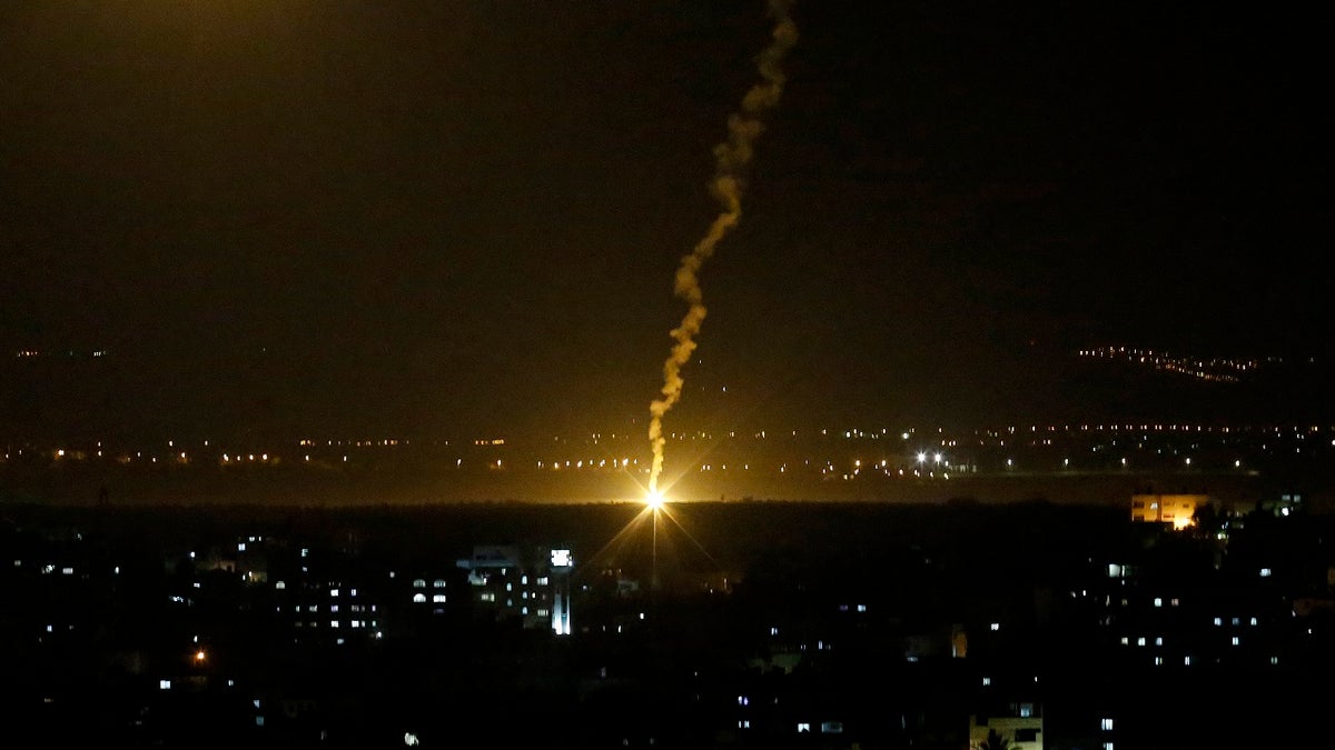 Flares fired from Israeli forces light up the night sky in Gaza City, Monday, Nov. 12, 2018, as the Israeli military launched fighter jets to strike "terror targets" throughout the Gaza Strip.