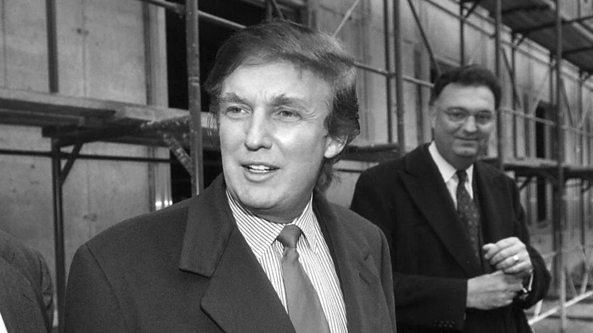 In this Nov. 5, 1996 file photo, American real estate mogul Donald Trump, left, checks out sites in Moscow, Russia, for luxury residential towers. Trump's decades-long dream of building a luxury tower in the heart of Moscow flared and fizzled several times over the years, most recently when his presidential campaign was gaining momentum.?