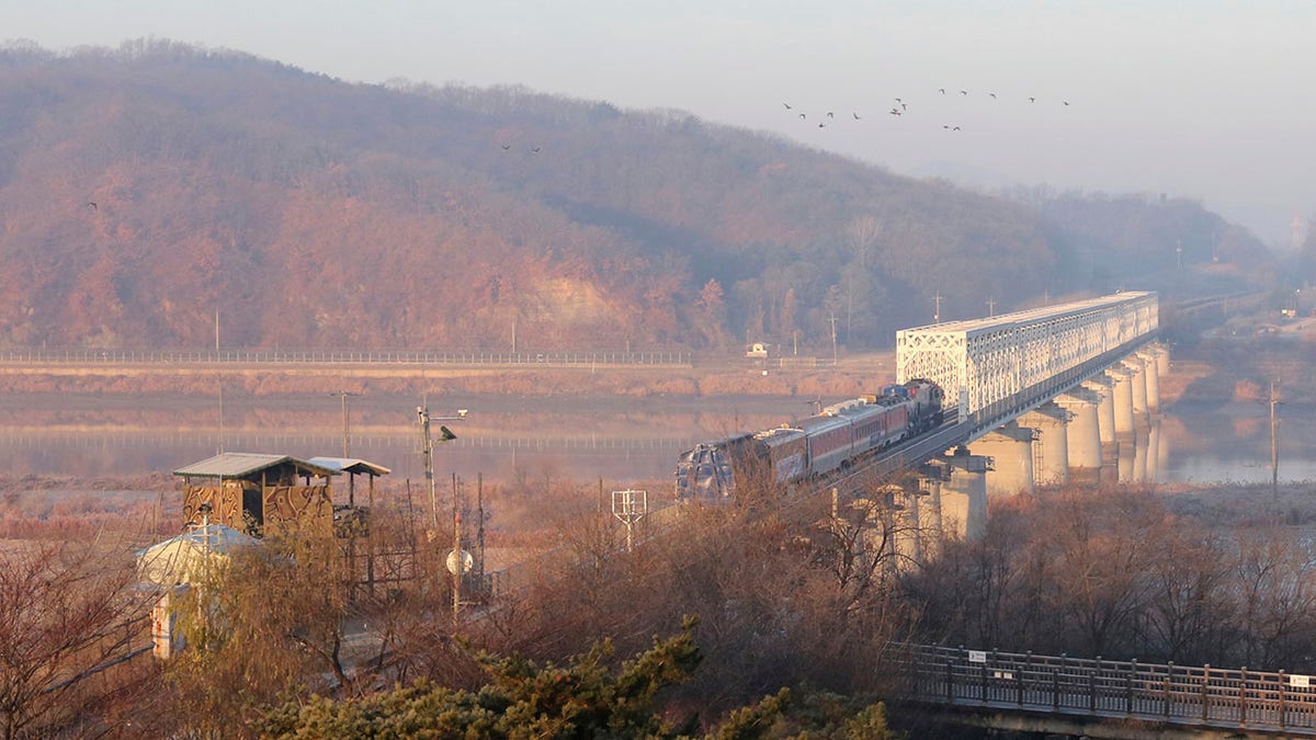A South Korean train runs on the rail track, which the two Koreas hope to eventually use as an international transport link, near to the border village of Panmunjom in North Korea, in Paju, South Korea, Friday, Nov. 30, 2018.  (AP Photo/Ahn Young-joon)