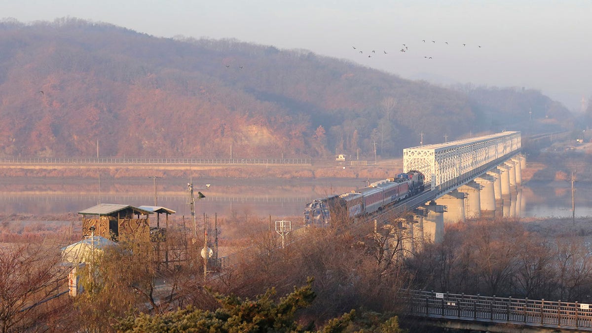 A South Korean train runs on the rail track, which the two Koreas hope to eventually use as an international transport link, near to the border village of Panmunjom in North Korea, in Paju, South Korea, Friday, Nov. 30, 2018. (AP Photo/Ahn Young-joon)