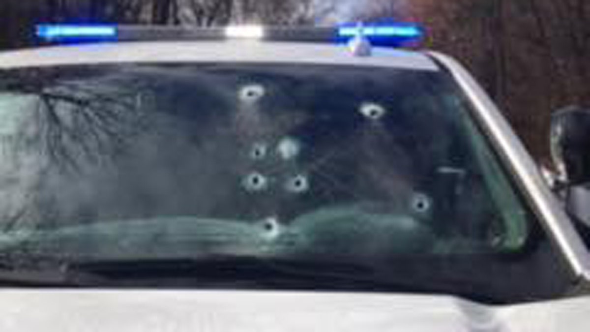 Bullet holes can be seen in Corporal Brett Thompson's vehicle after the shooting