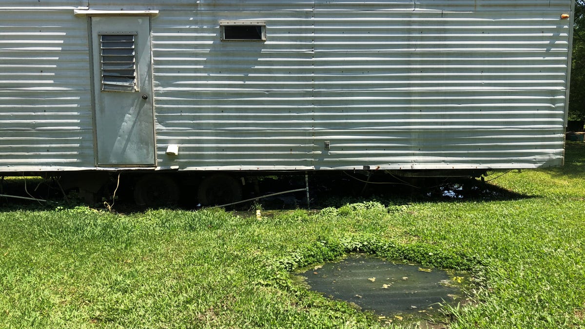 Raw sewage pit in yard of home, Lowndes County, AL.