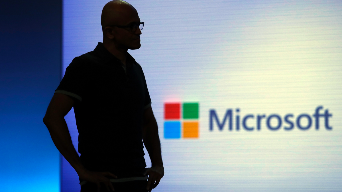 FILE- In this May 7, 2018, file photo Microsoft CEO Satya Nadella looks on during a video as he delivers the keynote address at Build, the company's annual conference for software developers in Seattle. (AP Photo/Elaine Thompson, File)