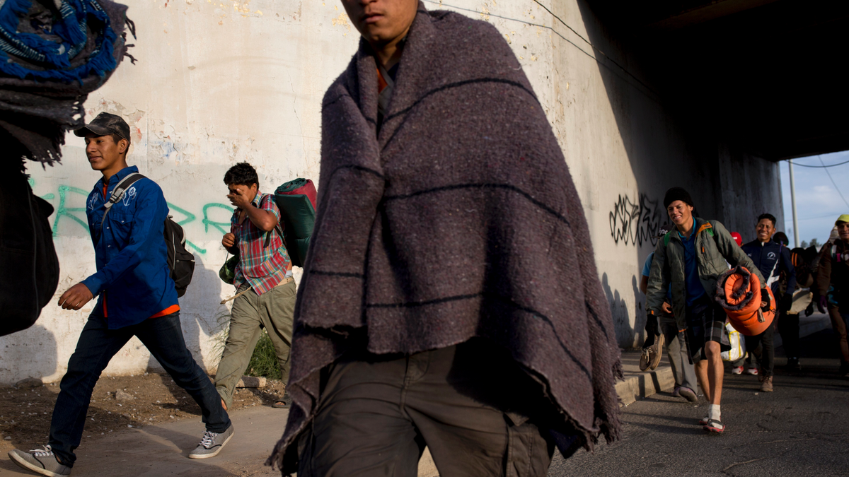 Central American migrants, part of the Central American caravan trying to reach the United States, continue their journey as they leave Mexicali, Mexico, Tuesday, Nov. 20, 2018. Tensions have built as nearly 3,000 migrants from the caravan poured into Tijuana in recent days after more than a month on the road, and with many more months likely ahead of them while they seek asylum in the U.S. (AP Photo/Rodrigo Abd)