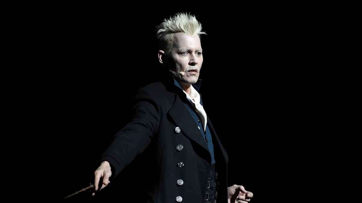 FILE - In this July 21, 2018 file photo, Johnny Depp appears in character as Gellert Grindelwald at the Warner Bros. Theatrical panel for "Fantastic Beasts: The Crimes of Grindelwald" on day three of Comic-Con International in San Diego. Depp's charismatic leader at the center of the new "Fantastic Beasts" sequel isn't modeled on President Donald Trump. But the stars of "Crimes of Grindelwald," which J.K. Rowling was writing during the 2016 U.S. presidential campaign, say there are some similarities. (Photo by Chris Pizzello/Invision/AP, File)