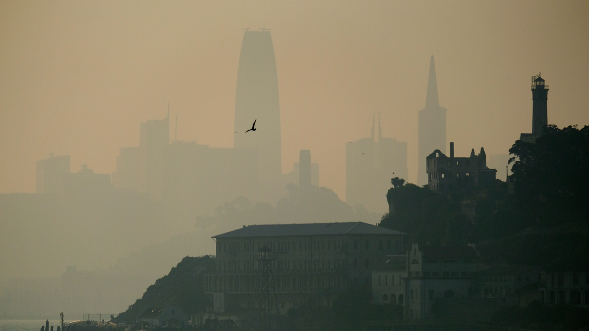 File photo - The San Francisco skyline is obscured by smoke and haze from wildfires behind Alcatraz Island Wednesday, Nov. 14, 2018, in San Francisco.