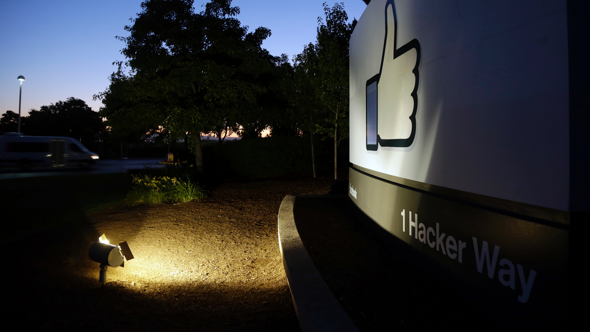 FILE- In this Jun 7, 2013, file photo, the Facebook "like" symbol is illuminated on a sign outside the company's headquarters in Menlo Park, Calif. (AP Photo/Marcio Jose Sanchez, File)