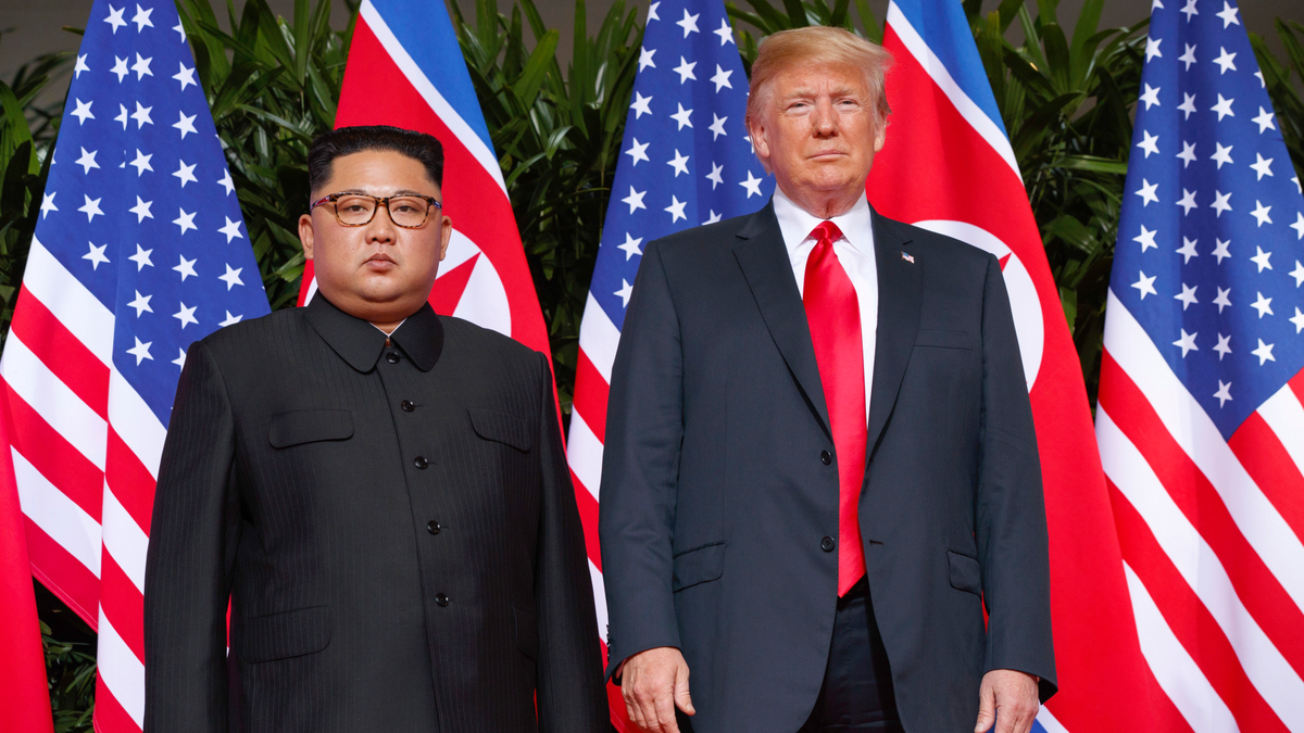 FILE - In this June 12, 2018, file photo, U.S. President Donald Trump stands with North Korean leader Kim Jong Un on Sentosa Island in Singapore. (AP Photo/Evan Vucci, File)