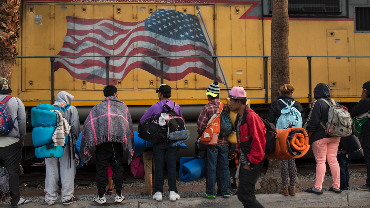 Central American migrants, part of the Central American caravan trying to reach the United States, continue their journey as they prepare to leave Mexicali, Mexico, Tuesday, Nov. 20, 2018. Tensions have built as nearly 3,000 migrants from the caravan poured into Tijuana in recent days after more than a month on the road, and with many more months likely ahead of them while they seek asylum in the U.S. (AP Photo/Rodrigo Abd)