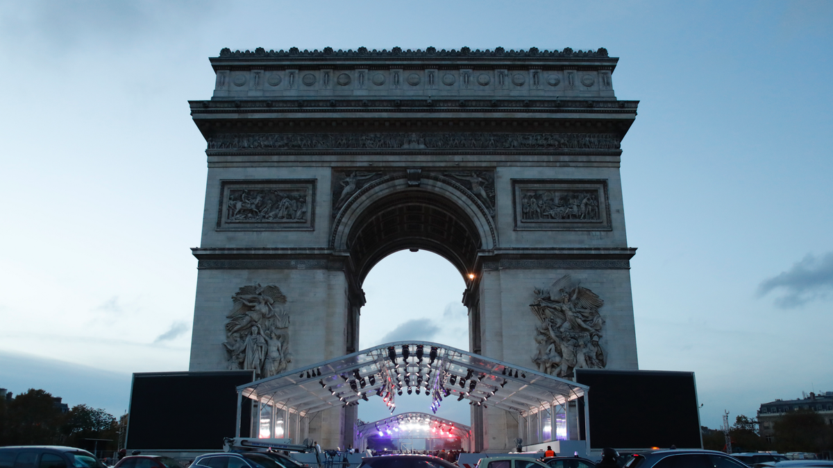 A stand is set up in front the Arc de Triomphe ahead of ceremonies marking the 100th of the end of World War I, Friday, Nov.9, 2018. About 60 leaders will mark Sunday the cease-fire that came on the 11th hour of the 11th day of the 11th month of 1918. (AP Photo/Thibault Camus)