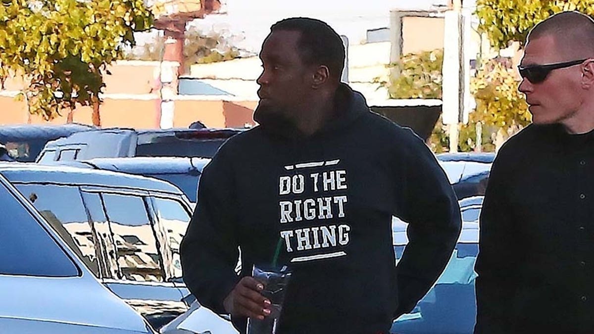 Sean 'Diddy' Combs appears completely shaken as he is seen arriving at an office building in Los Angeles a day after his ex Kim Porter's sudden death. The music mogul was seen entering a specialized movement rehabilitation center this afternoon. Kim passed away in her home yesterday. The couple have three children together.