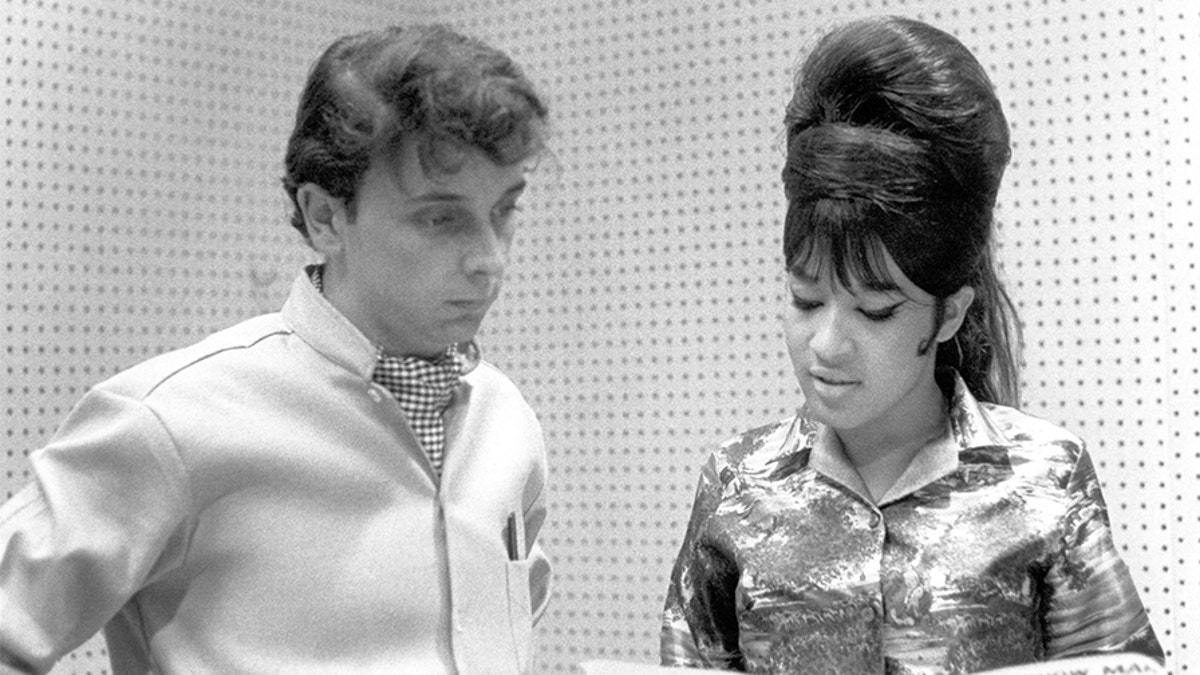 Ronnie Spector of the vocal trio the Ronettes with Phil Spector while recording in Los Angeles, California at Gold Star Studios in 1963.