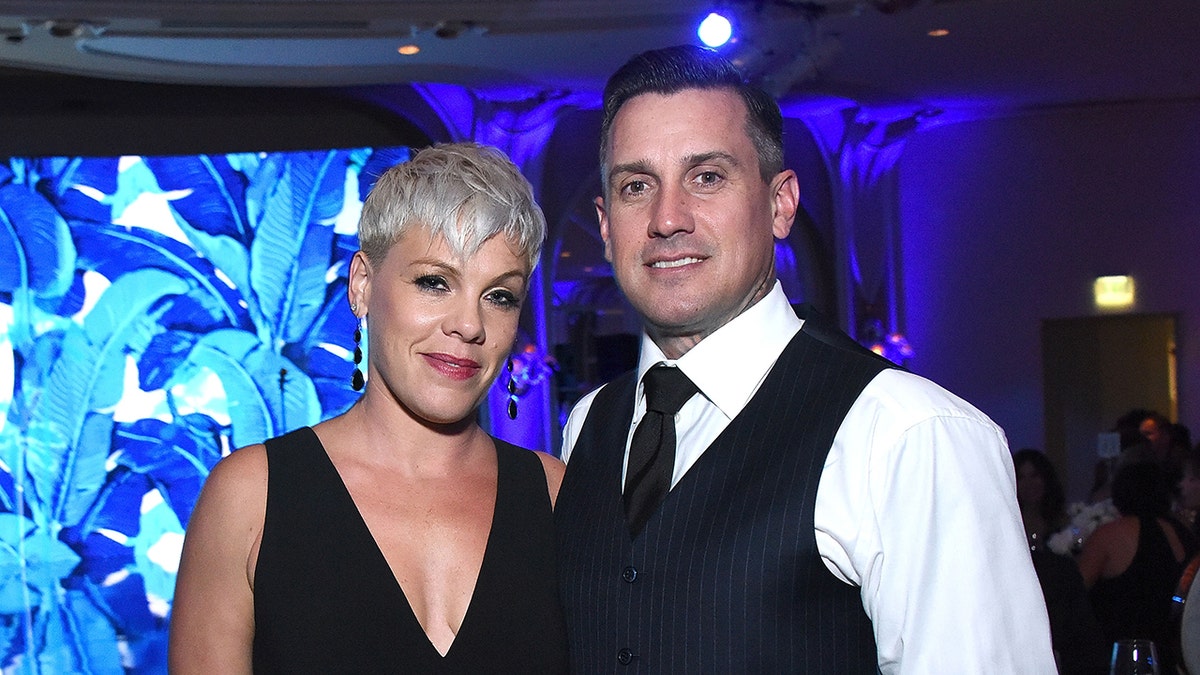 Pink's husband Carey Hart, right, posted a stern warning to looters on Instagram on Monday.