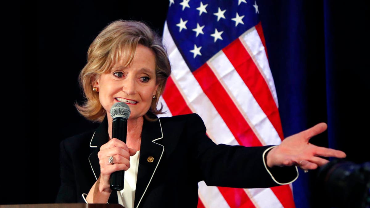 Republican U.S. Sen. Cindy Hyde-Smith celebrates her runoff win over Democrat Mike Espy in Jackson, Miss., Tuesday, Nov. 27, 2018. Hyde-Smith will now serve the final two years of retired Republican Sen. Thad Cochran's six year term. (AP Photo/Rogelio V. Solis)