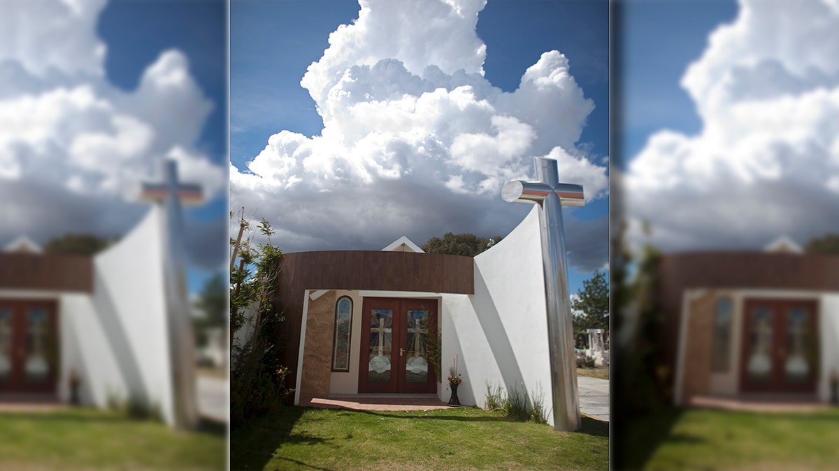 A tomb that was allegedly built by Heriberto Lazcano Lazcano, leader of the Zetas, stands at a cemetery in the neighborhood of Tezontle in Pachuca, Mexico, Tuesday, Oct. 9, 2012. The tomb is a small scale copy of a church in Tezontle, which at one point had a plaque naming Lazcano as the donor. (AP Photo/Alexandre Meneghini)