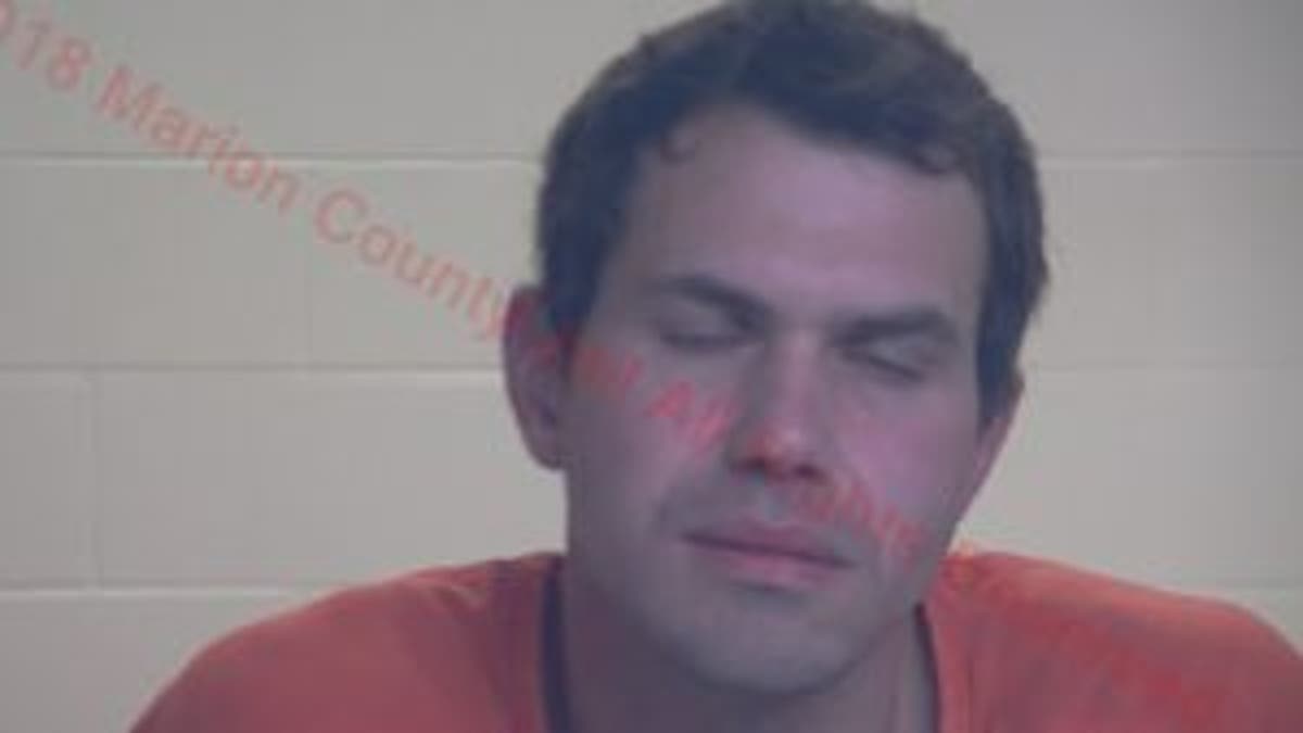 Matthew Smith, 37, was arrested after he was found carrying multiple weapons in his vehicle.