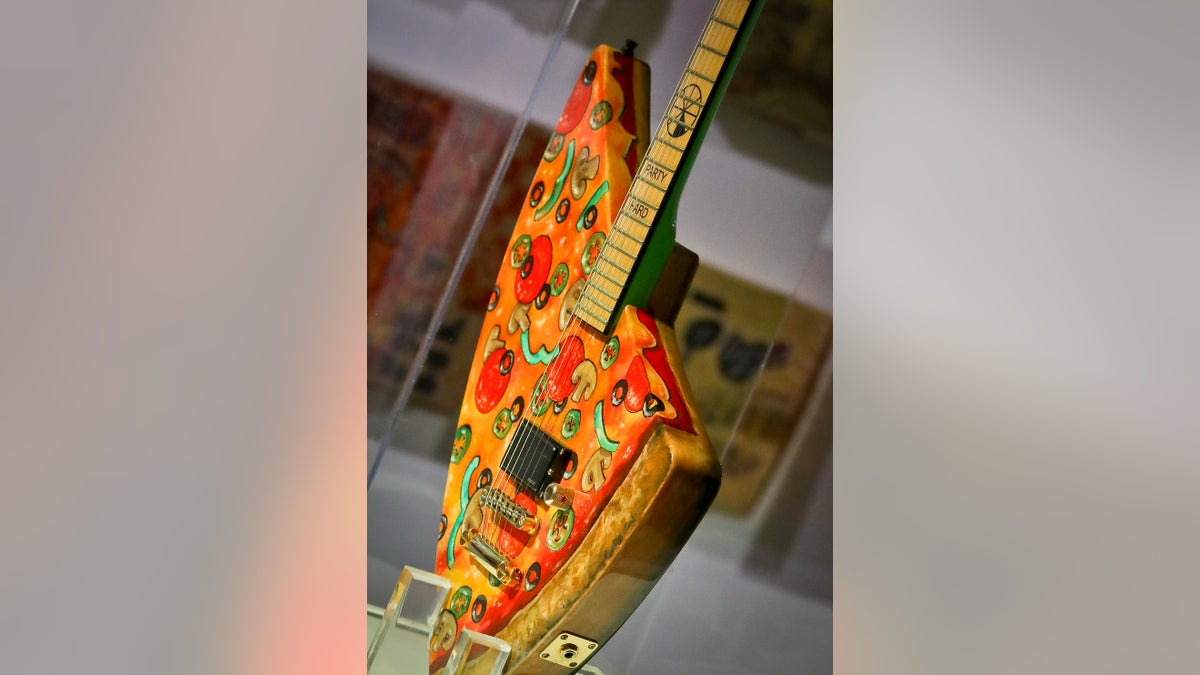 The "Pizza Guitar," from musician Andrew W.K., is part of a group art exhibition celebrating pizza at The Museum of Pizza in New York.