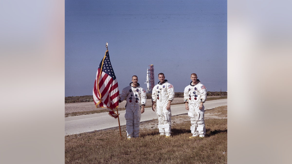Apollo 9 astronauts, left to right, James McDivitt, David Scott, and Russell Schweickart, stand in front of the Apollo/Saturn V space vehicle that would launch the Apollo 8 crew. The launch of the Apollo 9 (Saturn V launch vehicle, SA-504) took place on March 3, 1969. (NASA)