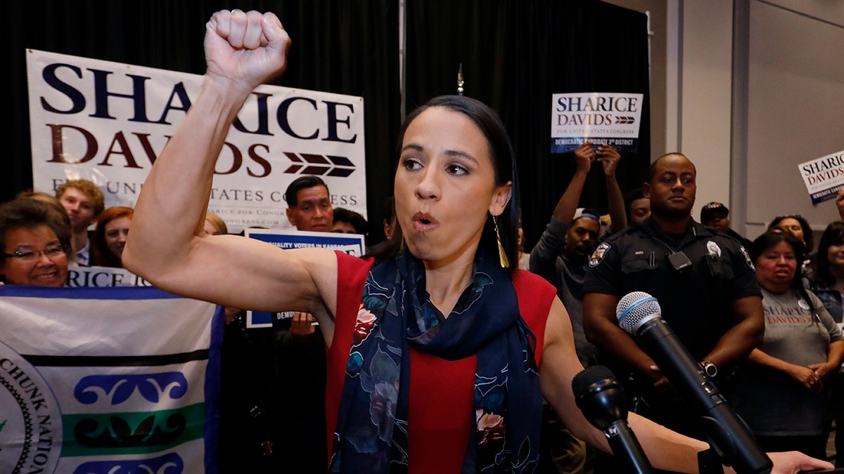 Democrat house candidate Sharice Davids reacts as she gives a victory speech to supporters at a victory party in Olathe, Kansas.