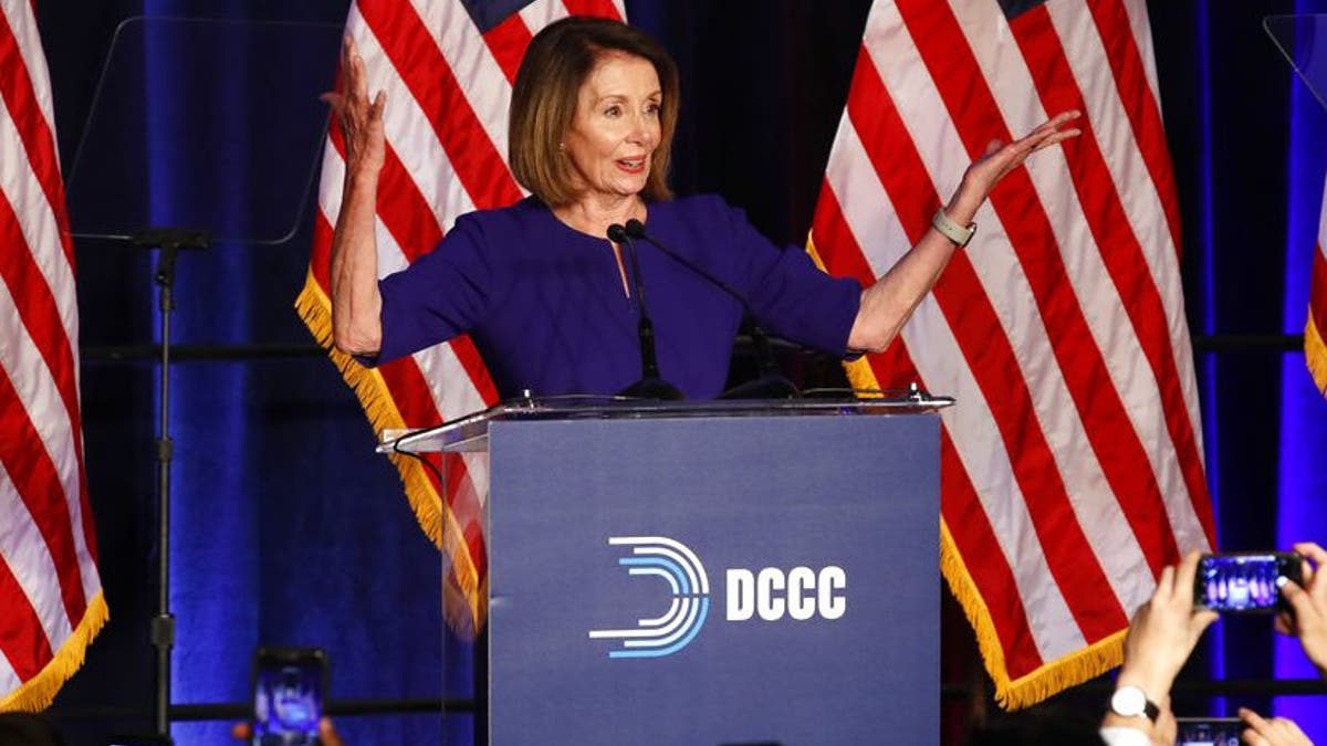 House Minority Leader Nancy Pelosi of Calif., smiles as she is cheered by a crowd of Democratic supporters during an election night returns event at the Hyatt Regency Hotel, on Tuesday, Nov. 6, 2018, in Washington. (AP Photo/Jacquelyn Martin)