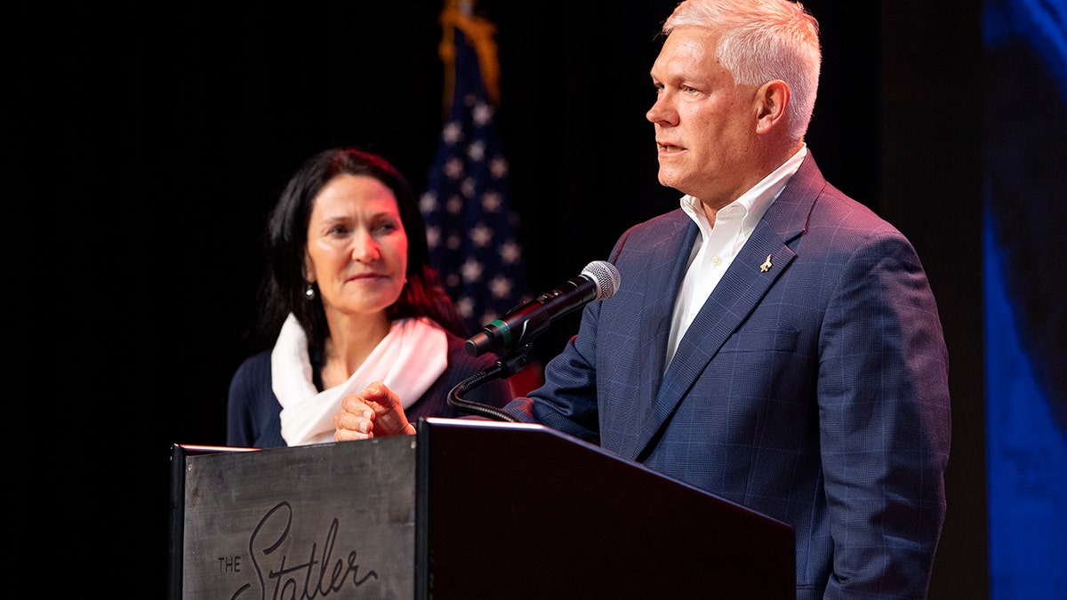 Incumbent U.S. Rep Pete Sessions, R-Texas, is joined by his wife on stage as he conceded the U.S. House race to Democratic challenger and first-time candidate Colin Allred. (AP Photo/Jeffrey McWhorter)