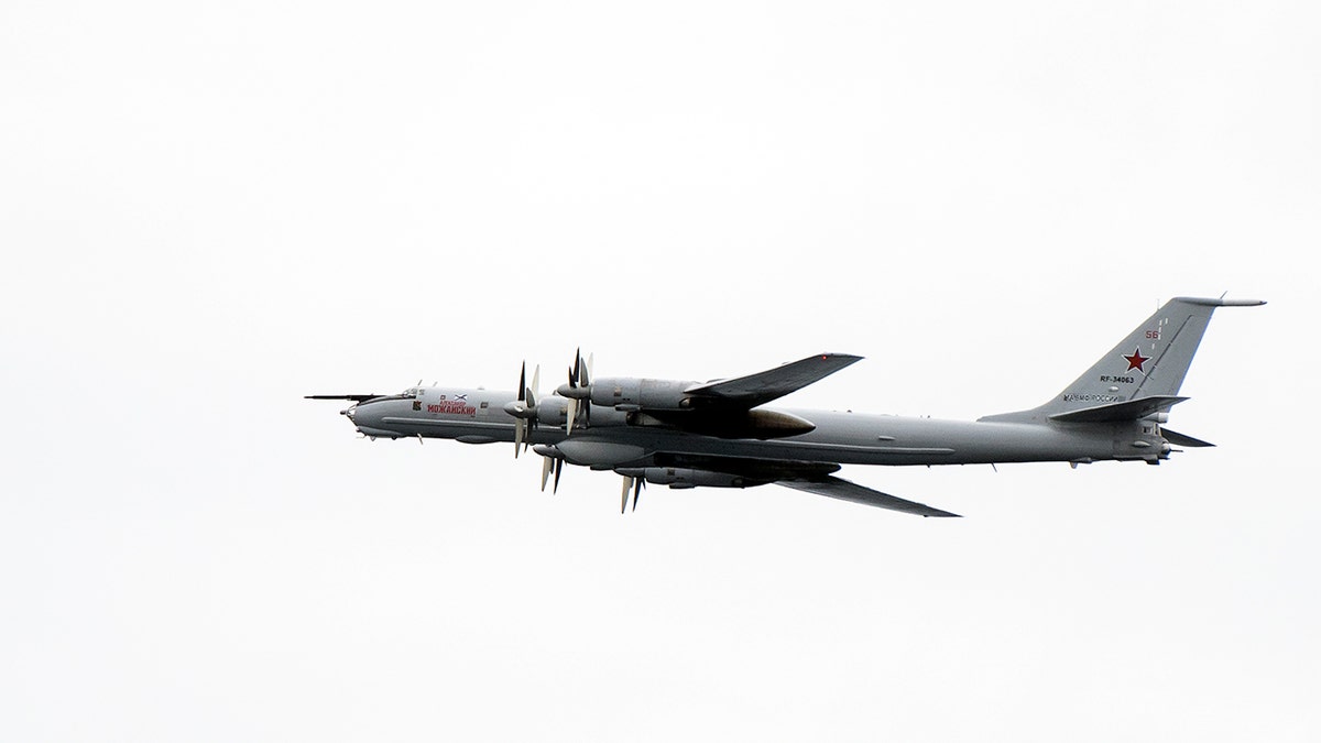 A Russian Tupolev TU-142 flies by the USS Mount Whitney of the US Navy during the NATO-led military exercise Trident Juncture.