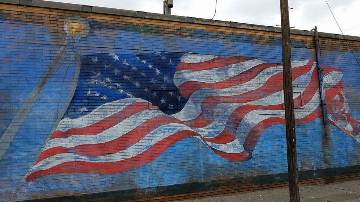 The American flag mural on the side of La Bella Pizza Bistro in New Paltz, NY before it was vandalized Monday night.