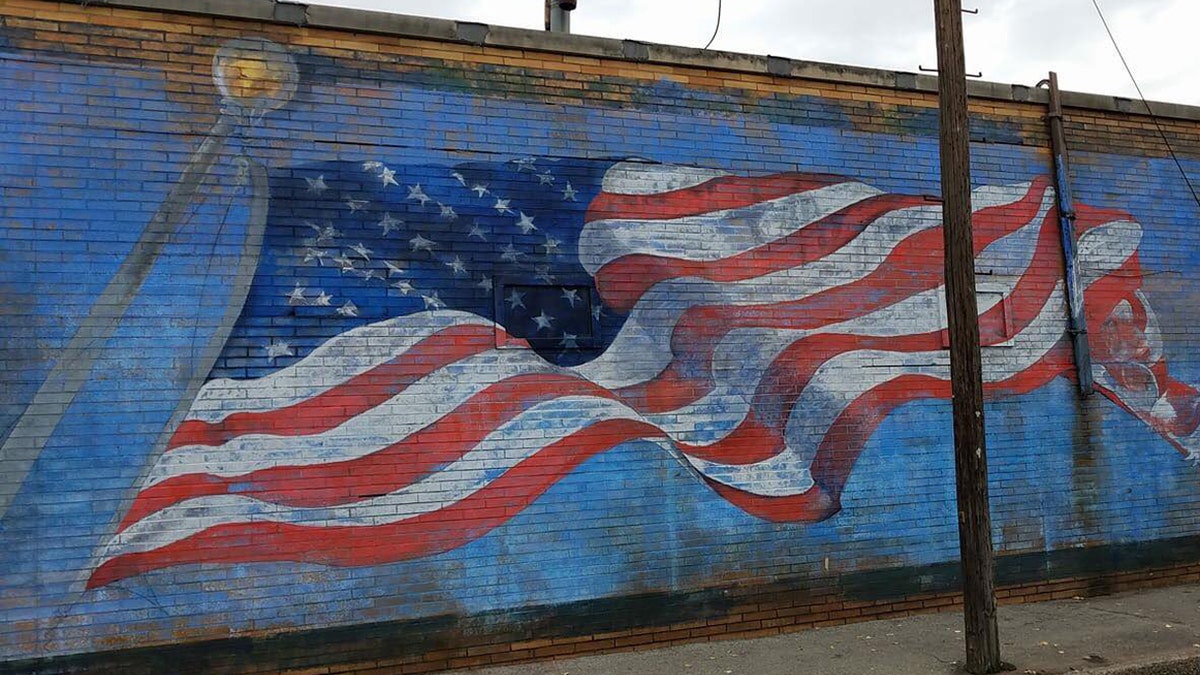 The American flag mural on the side of La Bella Pizza Bistro in New Paltz, NY before it was vandalized Monday night.