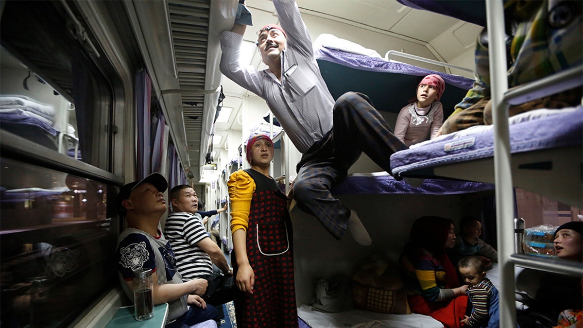 A Uighur group traveling on a train to Xingjiang, in Shanghai, May 14, 2014. (REUTERS/Aly Song, File)
