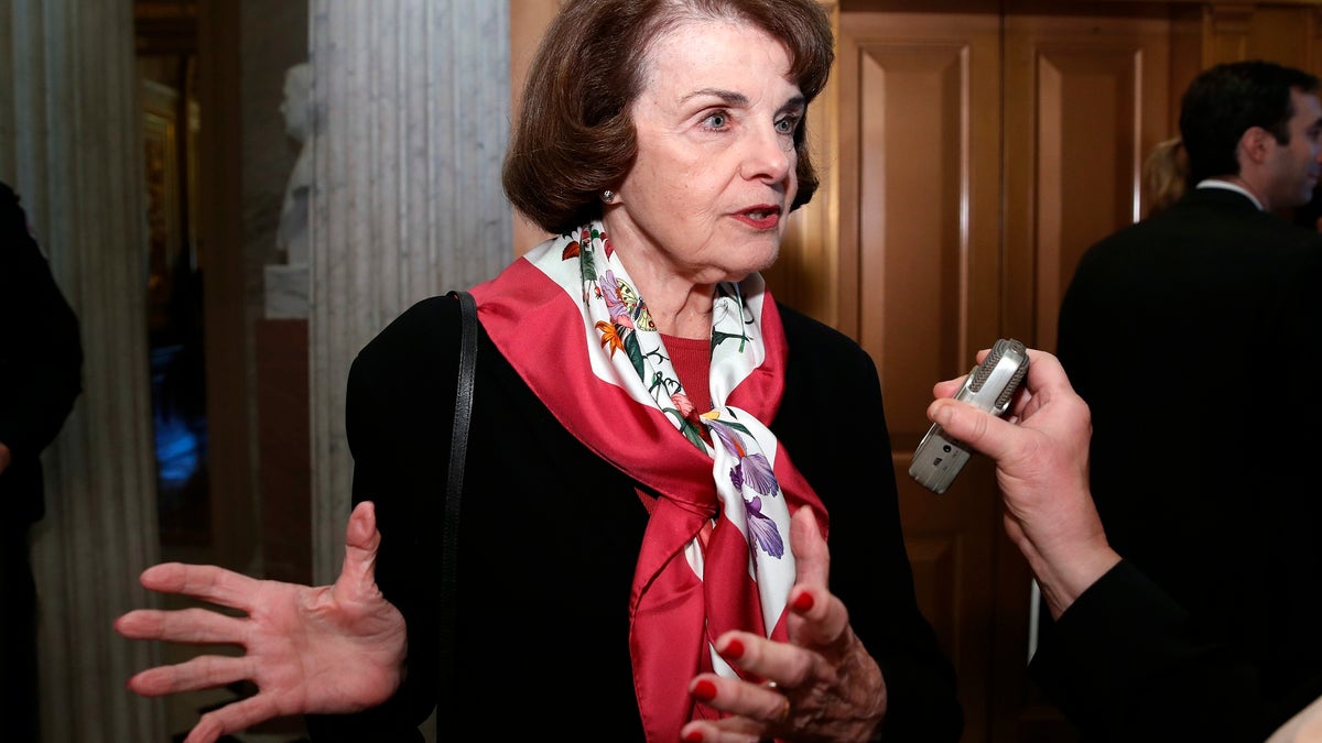 Sen. Dianne Feinstein, D-Calif., speaks with a reporter on Capitol Hill, Tuesday, Dec. 19, 2017 in Washington. (AP Photo/Alex Brandon)