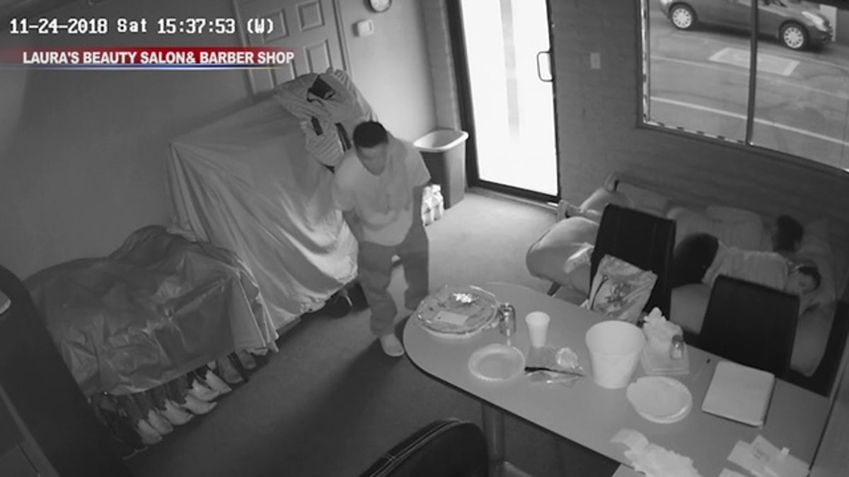 In surveillance video, Michael Farinas can be seen walking into an office as two children were asleep on the couch before trying to hide himself under a cloth and table.