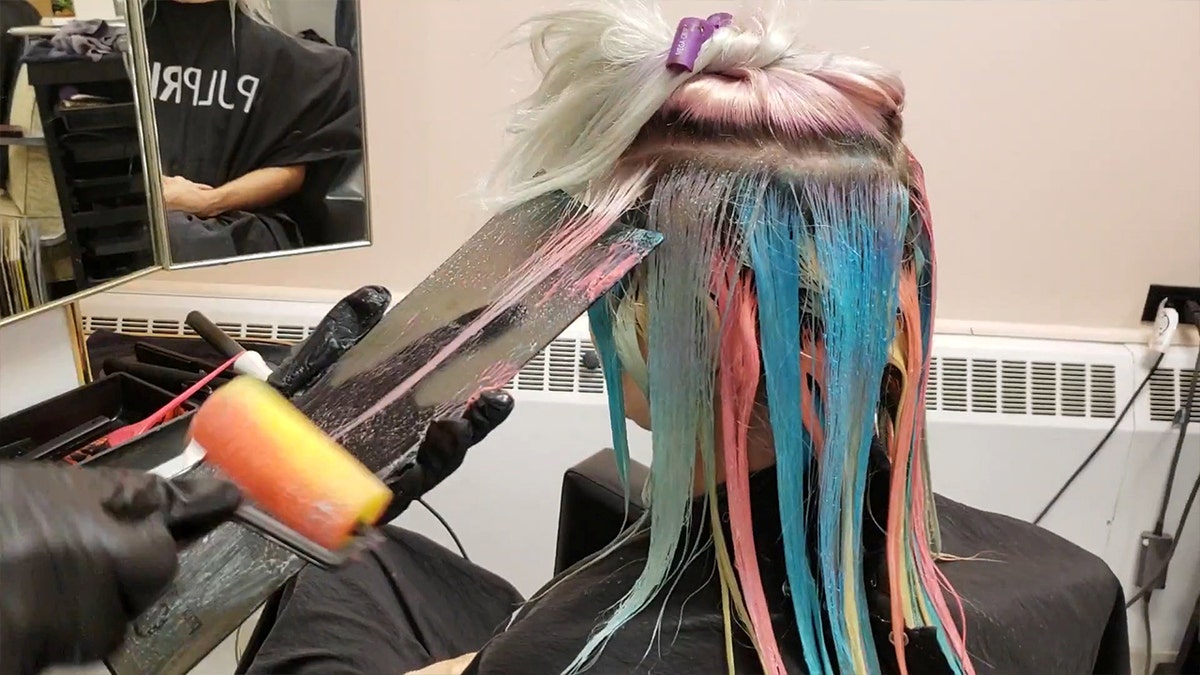Kelly O'Leary created the colorful look by dipping rollers normally used for decorating into different dyes.