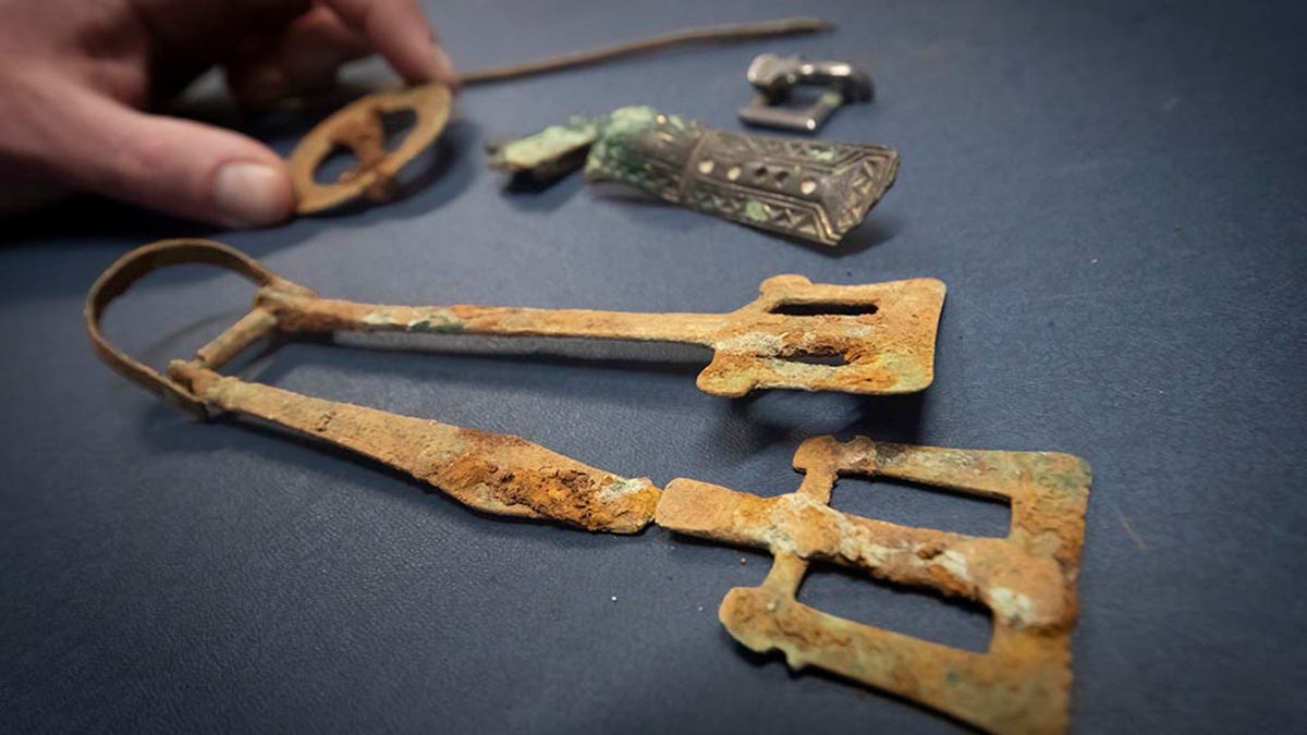 Some of the artifacts discovered during excavations at a previously unknown Anglo-Saxon cemetery that unearthed lavish burials of women with their jewelry and personal items.  (Press Association via AP Images)