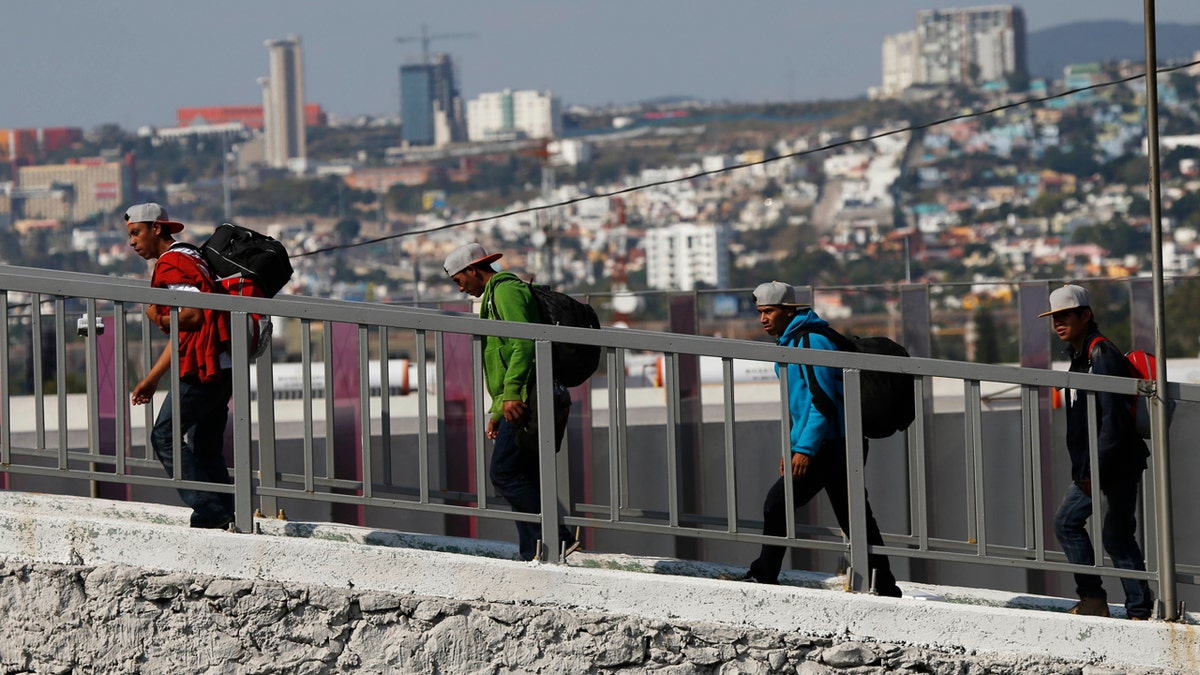Central American migrants arrive in Queretaro, Mexico, as they resume their journey north after leaving the temporary shelter in Mexico City, Saturday, Nov. 10, 2018.