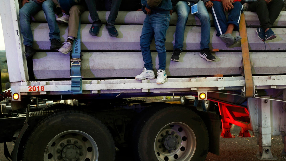 Central American migrants moving as a caravan toward the U.S. border get a free ride on a truck at IxtlÃ¡n del Rio, Nayarit, Mexico, Tuesday, Nov. 13, 2018.