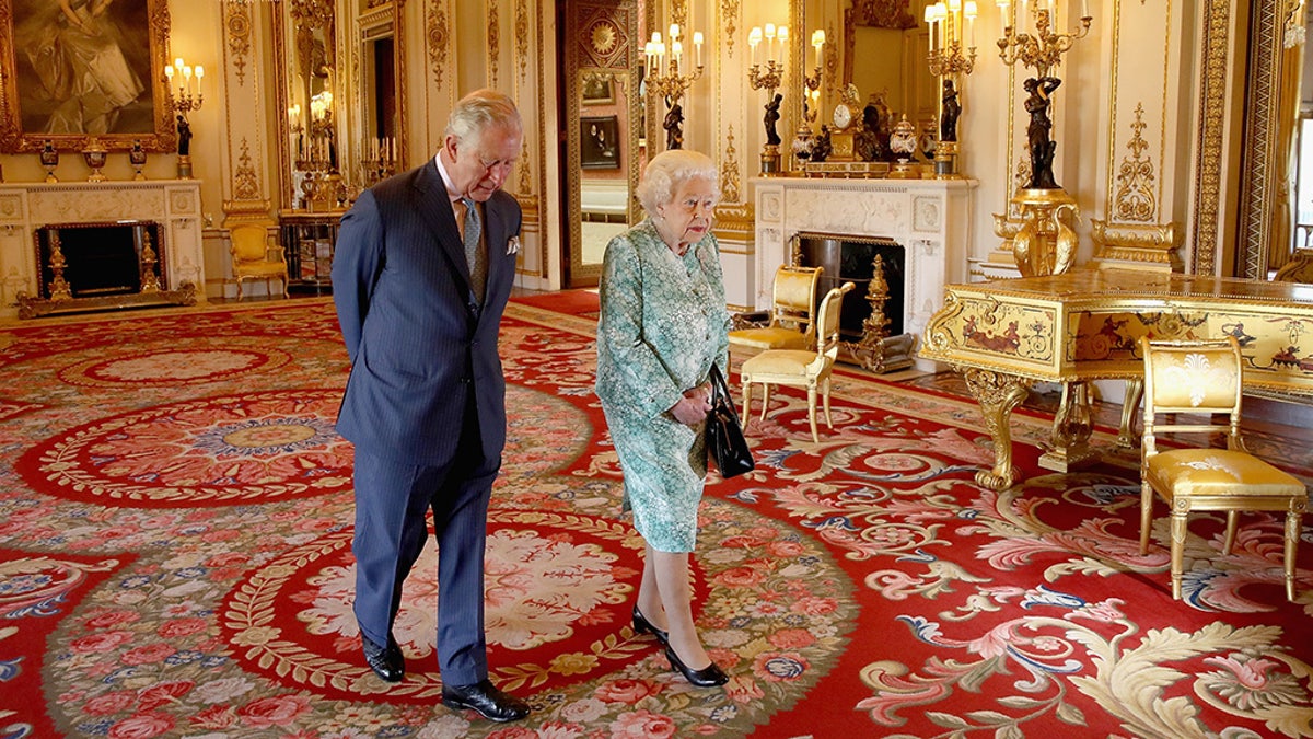 Images are part of a set to mark His Royal Highness's 70th birthday. Prince Charles, Prince of Wales and Queen Elizabeth II walk out ahead of the formal opening of the Commonwealth Heads of Government Meeting (CHOGM), in the ballroom at Buckingham Palace on April 19, 2018 in London, United Kingdom. (Chris Jackson/Getty Images for Clarence House)