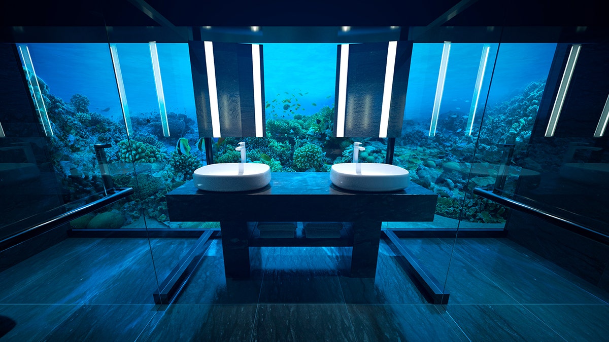 Lucky guests can enter the main attraction – an all-glass hotel room, 16.5 feet below sea level – via an elevator or spiral staircase that the outlet likens to “Alice’s rabbit hole” into a “watery wonderland.”