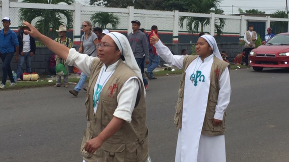 Two Catholic nuns from Guadalajara’s Misioneras de Christo Resuscitado flag down big rig in effort to aid migrants on Sunday, November 4, 2018.