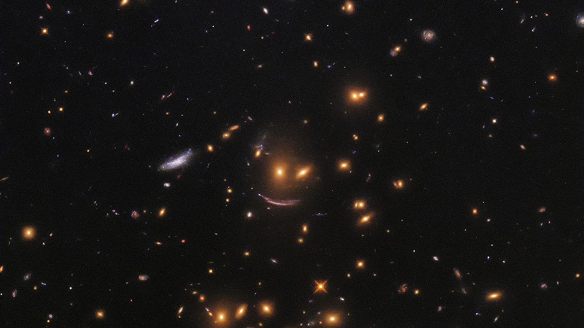 NASA recently shared a photo taken by the Hubble Space Telescope that shows a formation of galaxies forming what looks like a smiley face.<br data-cke-eol="1">