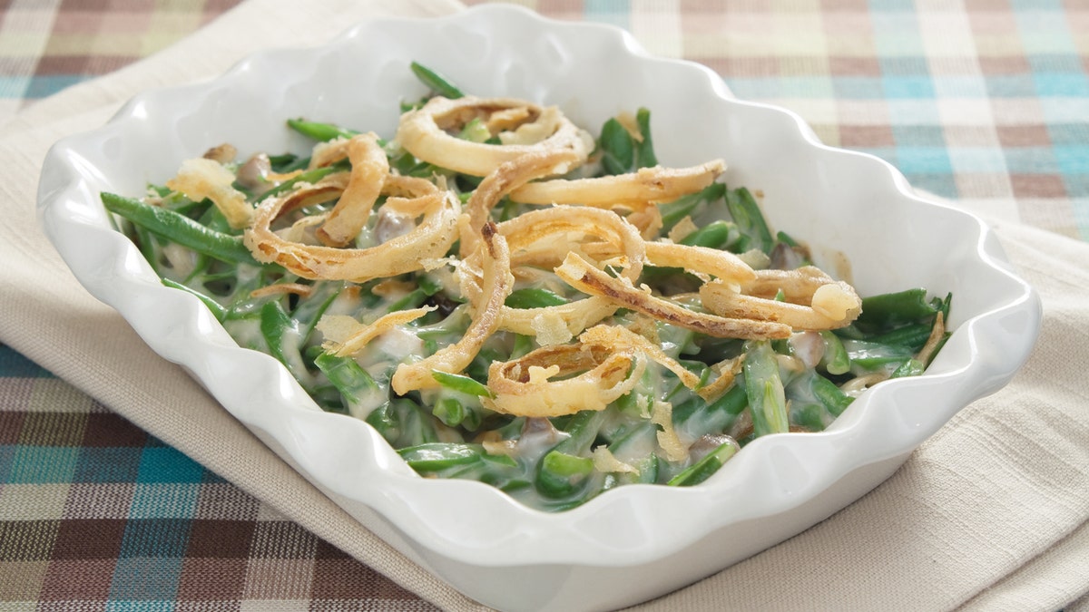 Green bean casserole is a traditional Thanksgiving side dish. The veggie is usually mixed with cream of mushroom soup and french-fried onions.