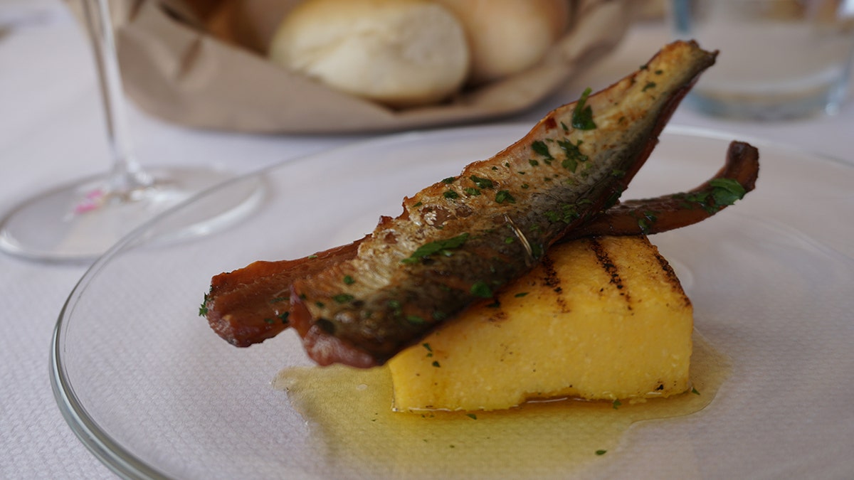 Monte Isola is famous for its local culinary traditions that include sardina, a preserved fish often served griddled and on a bed of polenta.
