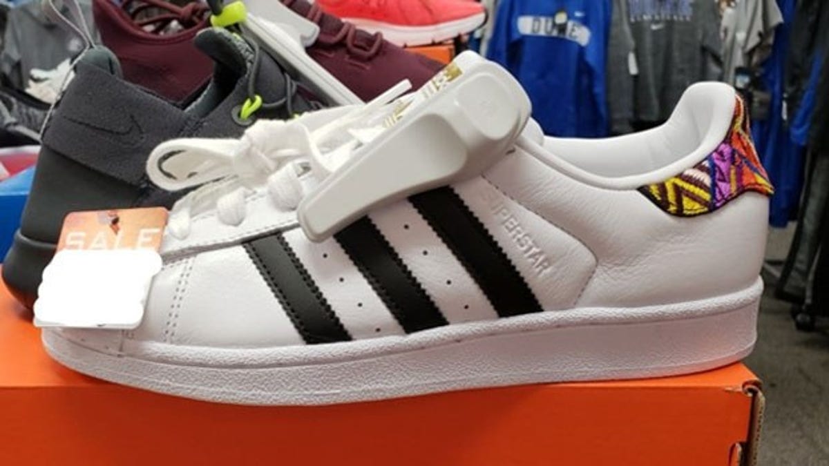 The FBI asked the public "to be on the lookout for a pair of shoes that belong" to Aguilar, that were described as white Adidas brand sneakers with black strips and "colorful stitching on the back heel of the shoe."