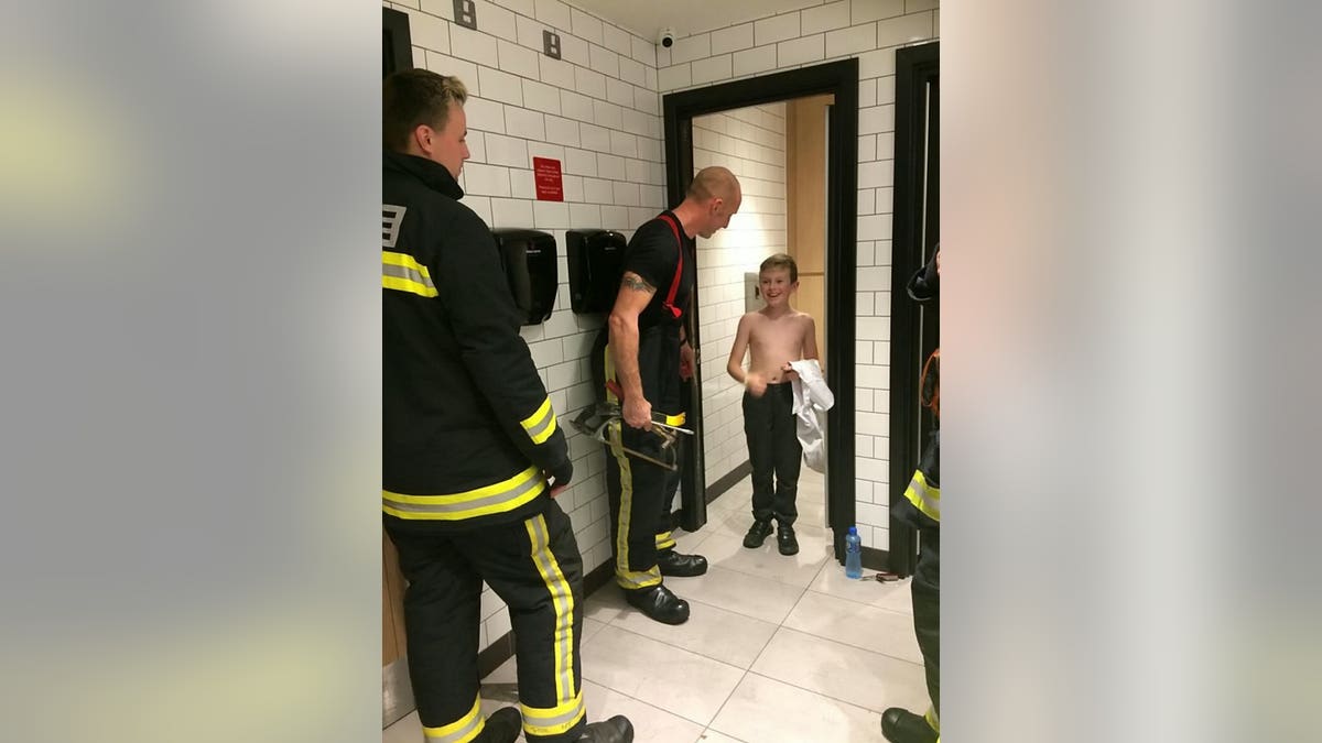 Mum told 'not to panic' as she gets trapped in public toilet in