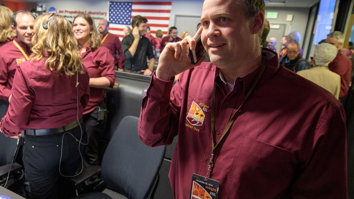NASA Administrator Jim Bridenstine receives a congratulatory call from Vice President Mike Pence after receiving confirmation of the successful landing of the agency's InSight spacecraft on Mars on Nov. 26, 2018 at the Mission Support Area of NASA's Jet Propulsion Laboratory in Pasadena, California.