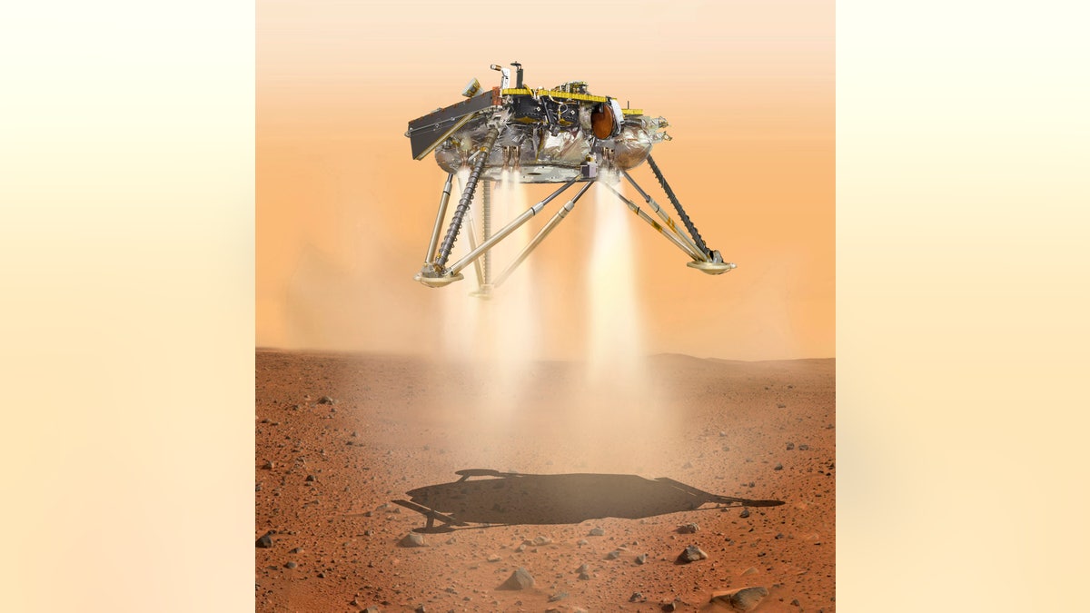 This illustration made available by NASA in October 2016 shows an illustration of NASA's InSight lander about to land on the surface of Mars. NASA's InSight spacecraft will enter the Martian atmosphere at supersonic speed, then hit the brakes to get to a soft, safe landing on the alien red plains. After micromanaging every step of the way, flight controllers will be powerless over what happens at the end of the road, nearly 100 million miles away. (NASA/JPL-Caltech via AP