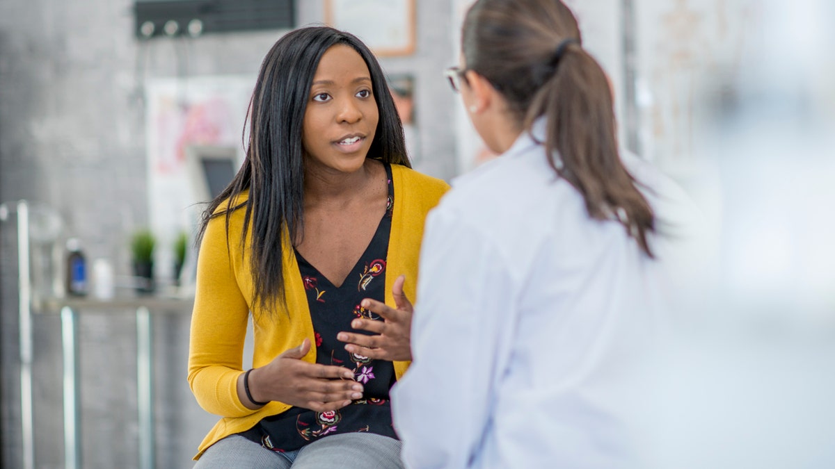 woman talking with doctor