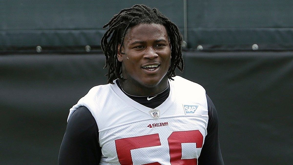 San Francisco 49ers linebacker Reuben Foster walks on the field during a practice at the team's NFL football training facility in Santa Clara, Calif.