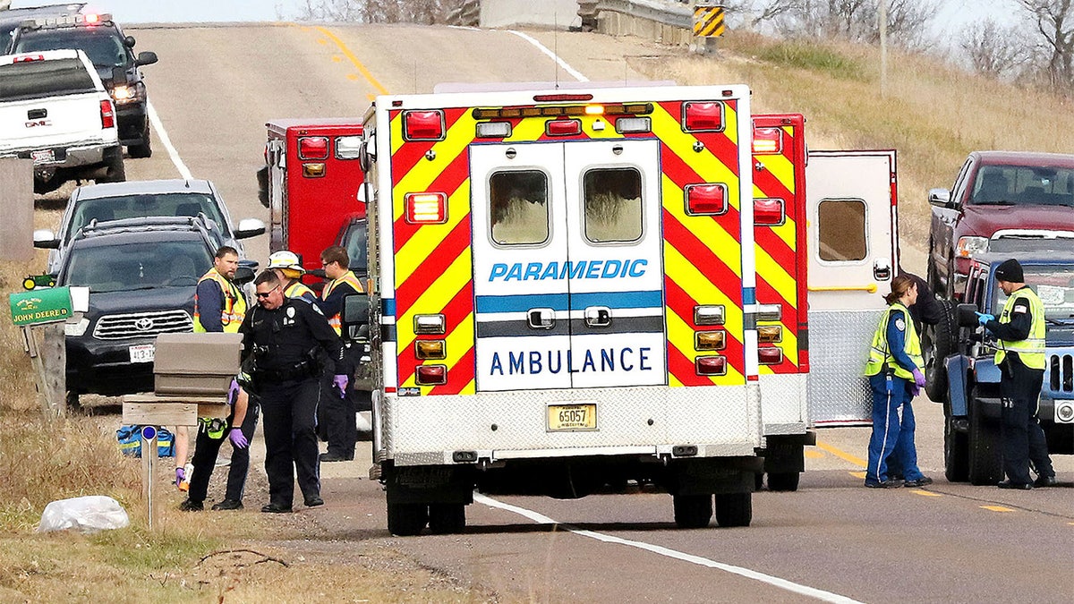 Emergency medical personnel gather at the scene of a hit-and-run accident Saturday, Nov. 3, 2018, in Lake Hallie, Wisconsin, that killed three girls and an adult. (Steve Kinderman/The Eau Claire Leader-Telegram via AP)
